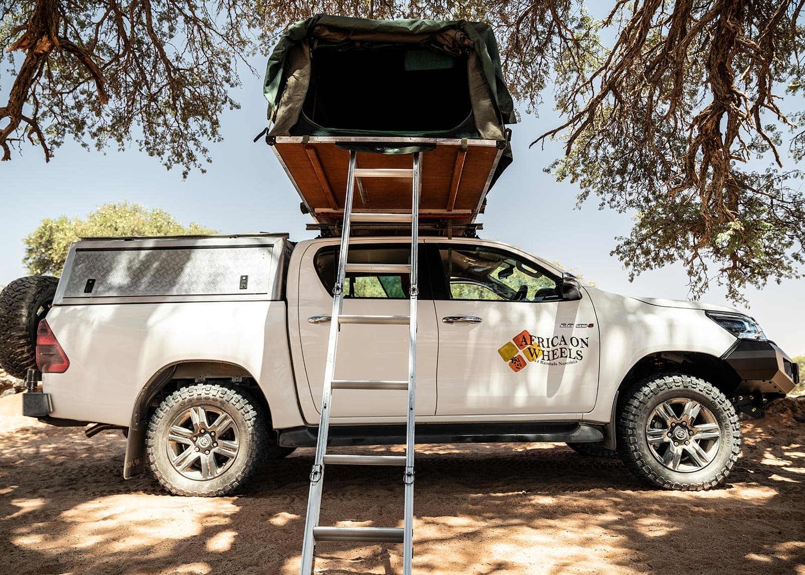 Group-6a-2.8-Toyota-Hilux-fully-equipped-for-two-persons-camping-tent-open